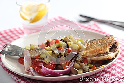 Roasted sea bass with vegetables Stock Photo