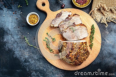 Roasted sliced Christmas ham of turkey. large piece of baked pork with mustard on a cutting board. banner, menu recipe place for Stock Photo