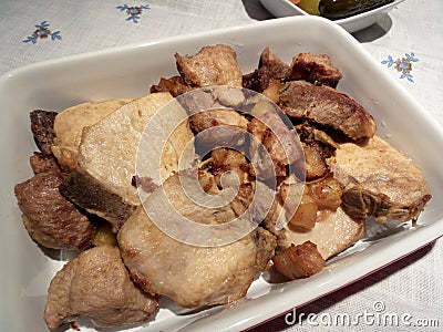 Roasted slices of pork in a plate Stock Photo