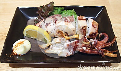 Roasted Squid with Lemon and Mayonnaise Stock Photo