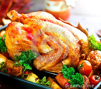 Roasted turkey garnished with potato. Thanksgiving or Christmas dinner Stock Photo