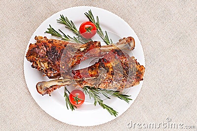 Roasted turkey legs on white plate Stock Photo