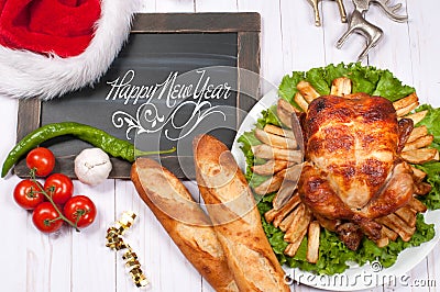 Roasted whole chicken and apple pie with Christmas decoration. Christmas dinner. Thanksgiving table served with turkey Stock Photo