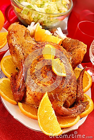 Roasted whole chicken with oranges Stock Photo