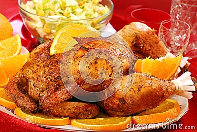 Roasted whole chicken with oranges Stock Photo