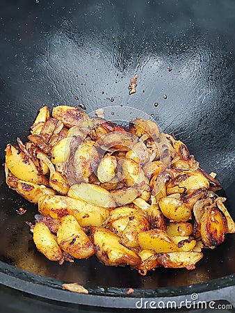 Roasted young potatoes with onion Stock Photo