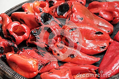 Roasting big red bell peppers, paprika. Concept of preparing preserves and delicious food Stock Photo