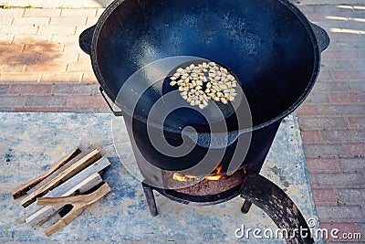 Roasting of mutton fat to a condition of crackers, some stage of preparation of a national Uzbek dish pilaf, shovel for Stock Photo