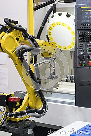 Robot arm auto load and unload CNC turning part Stock Photo