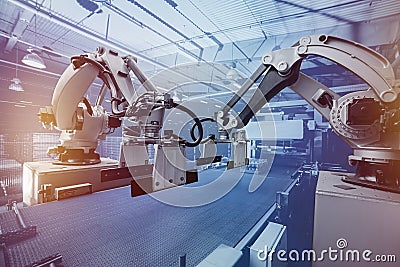 Robot arm manipulator. Modern packaging line for water and beer and drinks warehouse Stock Photo