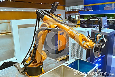 Robot arm manufacturing worker Stock Photo