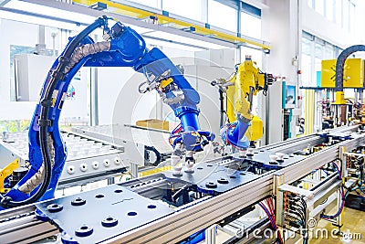 Robot arm robotic hand Robot assembly line automation modern factory workshop Stock Photo