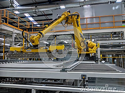 Robot in Can Manufacturing Plant Editorial Stock Photo