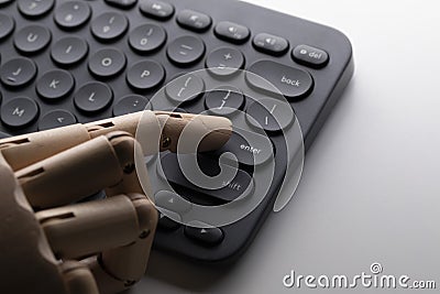 Robot finger over enter key Stock Photo