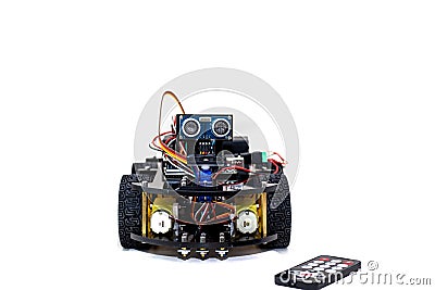 Robot with four wheels and control on a white background Stock Photo