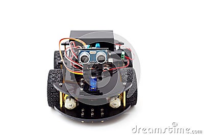 A robot on four wheels on a white background. Artificial Intelligence Stock Photo