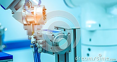 Robot hand machine gripping simulated object on blurred background. Use smart robot in manufacturing industry. Robotic tool Stock Photo