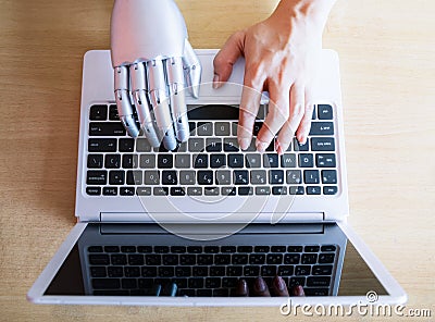 Robot hands and fingers point to laptop button advisor chatbot robotic artificial intelligence Stock Photo