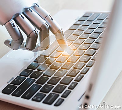 Robot hands and fingers point to laptop button advisor chatbot robotic artificial intelligence concept with light Stock Photo