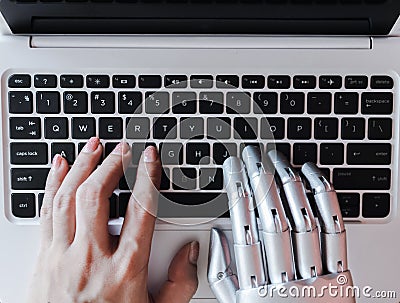 Robot hands and fingers point to laptop button advisor chatbot robotic artificial intelligence Stock Photo