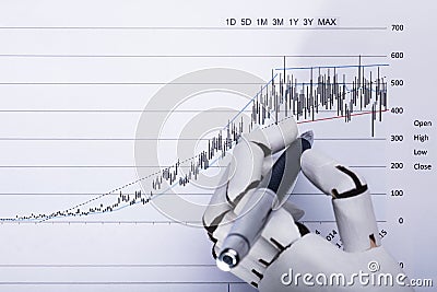 Robot Holding Pen Over Financial Document Stock Photo