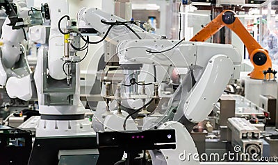 Robot Industrial 4.0 of things technology robot arm and man using controller Stock Photo