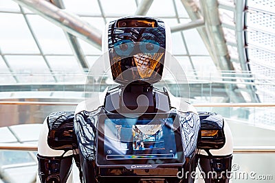 robot portrait close-up. smiling face of robot, photographer's reflection. Autonomous personal assistant robot Editorial Stock Photo