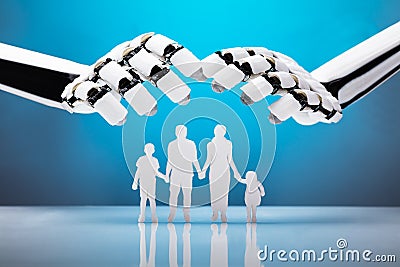 Robot Protecting Family Figures Stock Photo