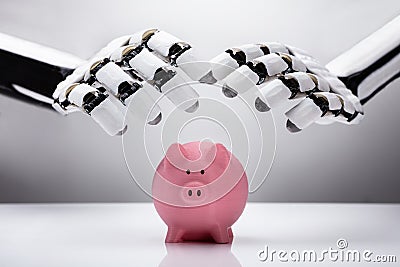 Robot Protecting Piggybank Stock Photo