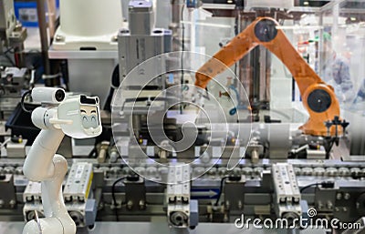 Robot replacement Industrial of things technology robot future arm and man using controller for control electronic Stock Photo