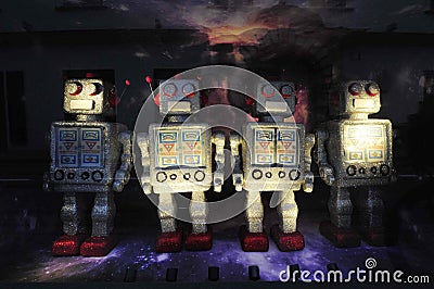 Robot toy figures on space background Stock Photo