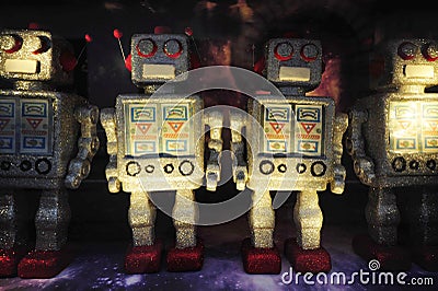 Robot toy figures on space background Stock Photo