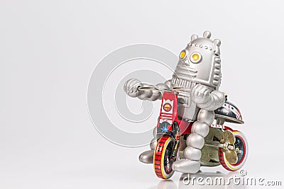 A robot toy is riding bicycle Stock Photo