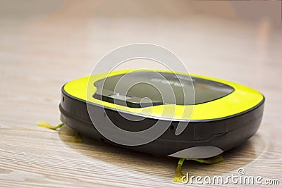 Robot vacuum cleaner close-up on the floor. Stock Photo