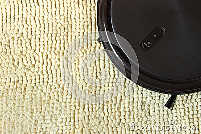 Robot Vacuum Cleaner Close Up. Indoor, housework Stock Photo