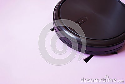 Robot vacuum cleaner performs automatic cleaning. Indoor, housework Stock Photo