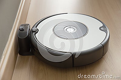 Robot vacuum cleaner return to charging at dock Stock Photo