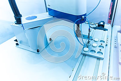 Robot with vacuum suckers picks the item from the conveyor Stock Photo