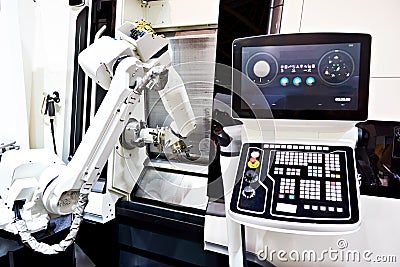Robotic arm and cnc lathe Stock Photo