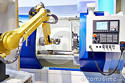 Robotic arm and cnc lathe Stock Photo