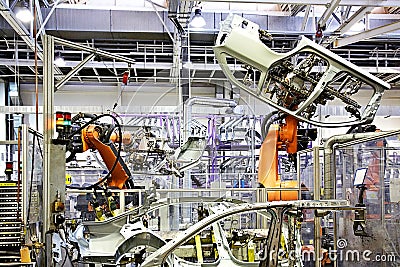 Robotic arms in a car factory Stock Photo
