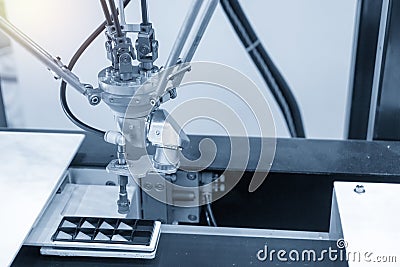 The robotic linkage-arm use in electronics production line. Stock Photo