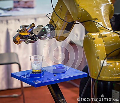 Robotic pouring beer Stock Photo