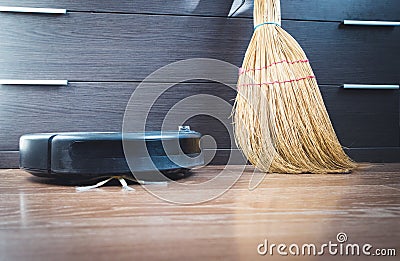 robotic vacuum cleaner on laminate wood floor smart cleaning Stock Photo