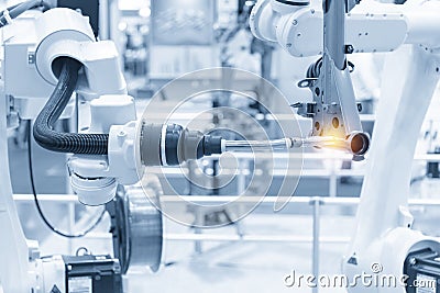 The robotics arm welding the automotive parts. Stock Photo