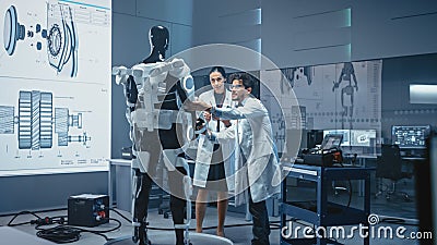 In Robotics Development: International Team of Engineers and Scientists Work on Robotics Exoskelet Stock Photo