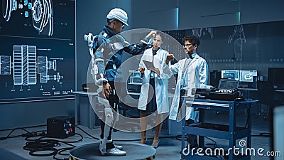 In Robotics Development Laboratory: Engineers and Scientists Work on a Bionics Exoskeleton Prototy Stock Photo