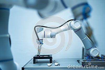Robotics Industry Engineering programming and Manipulating Robot Hand Arm, Industrial Robotics Design, High Tech Facility, Modern Stock Photo