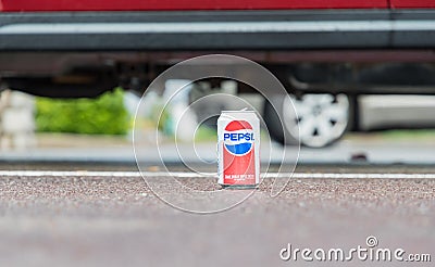 Rochester, USA. June 17, 2018. Metal can of pepsi cola on car background Editorial Stock Photo