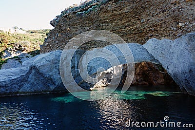 Rock arch at the natural pools on Ponza Island in Italy Stock Photo